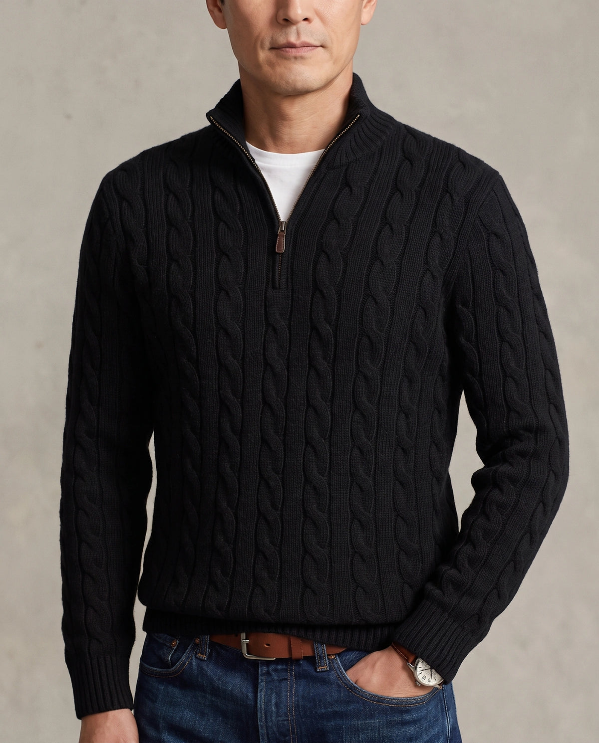 Model  wearing a black cable-knit quarter-zip sweater with a high mock neck