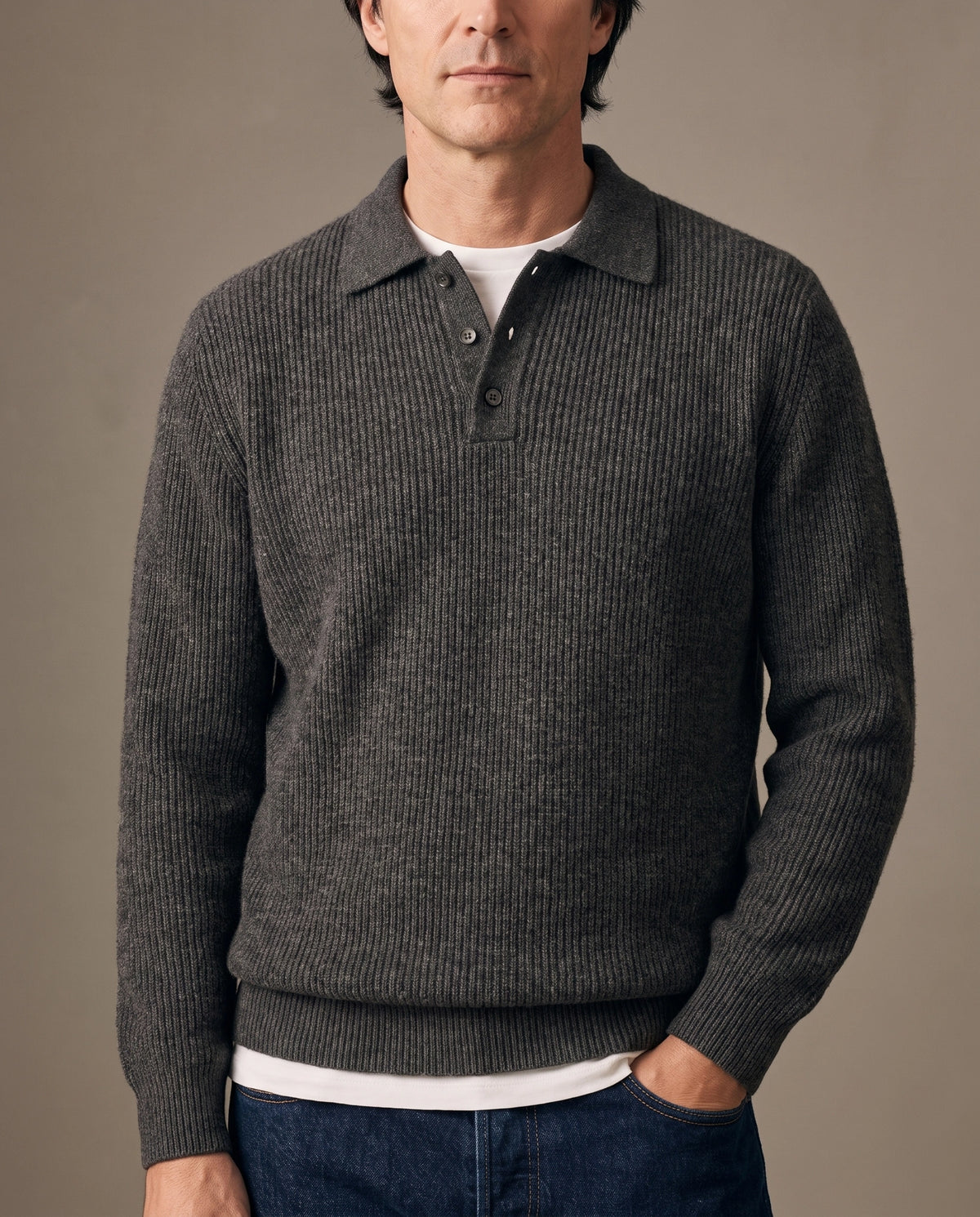 Model wearing a dark gray ribbed knit polo sweater