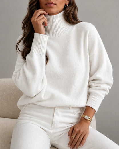 woman wearing a cozy white ribbed turtleneck sweater